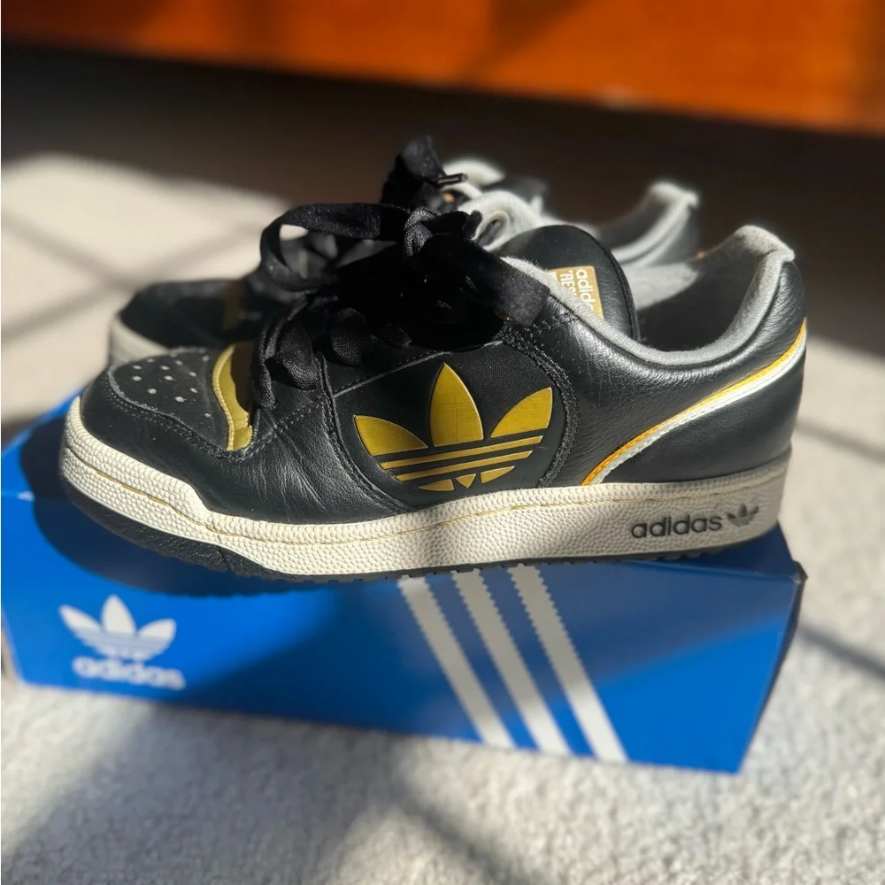 Adidas Sneakers in Black and Gold